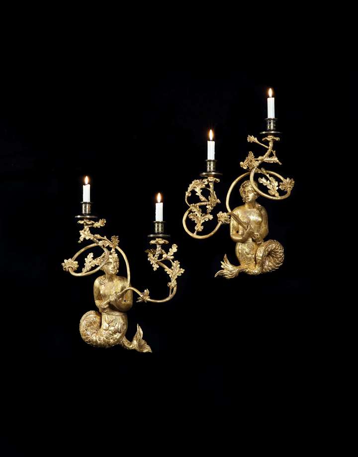 A PAIR OF REGENCY GILTWOOD TWIN LIGHT MERMAID WALL LIGHTS